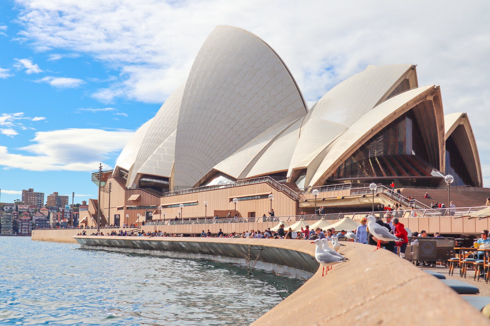people gathering outside sydney opera house